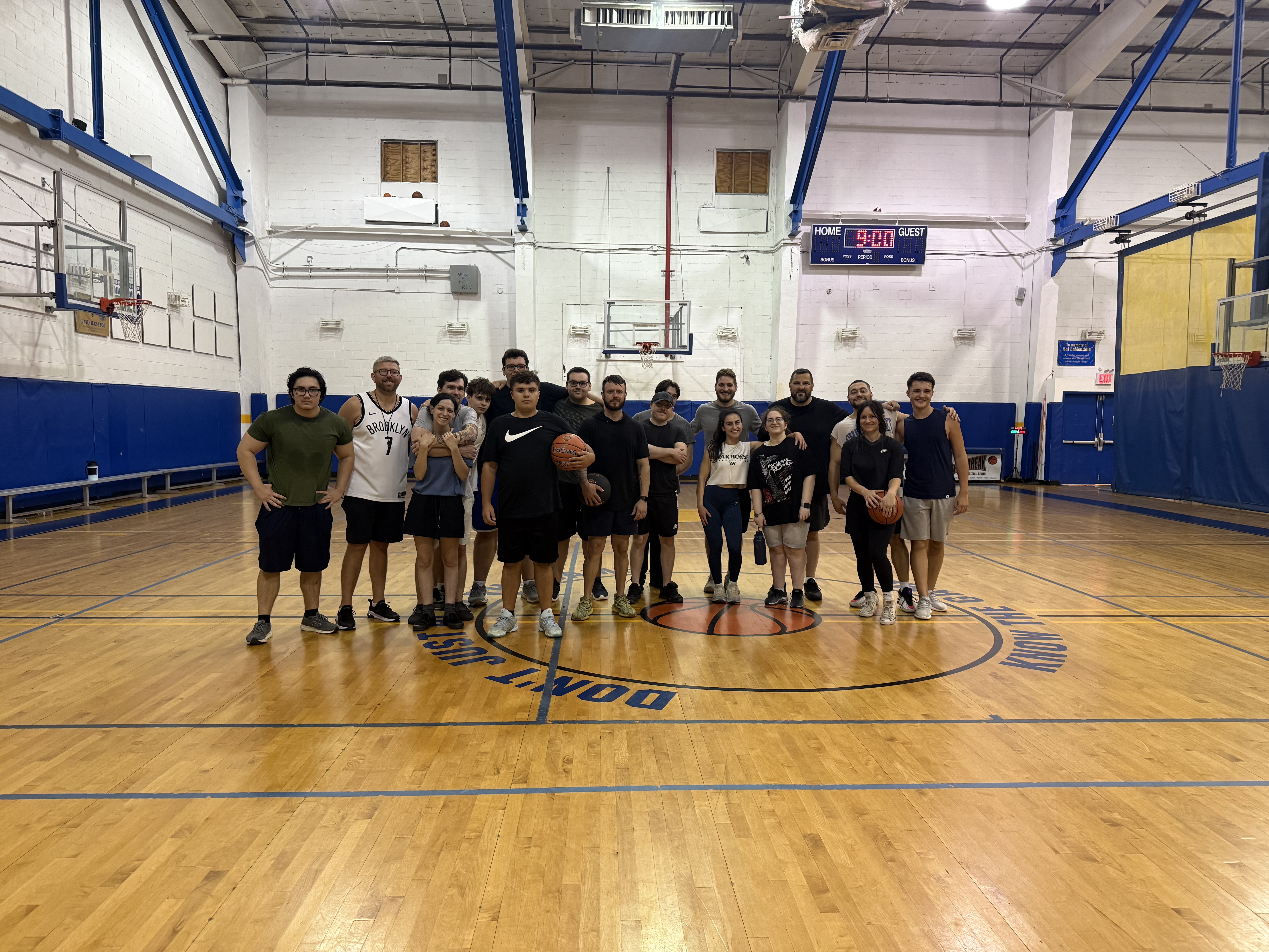 Fenix Basketball athletes and coaches together on the court